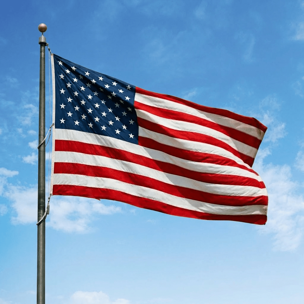 United States flag with stars and stripes waving on a flagpole
